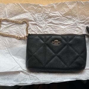 Coach black quilted wristlet with 8 card slots inside